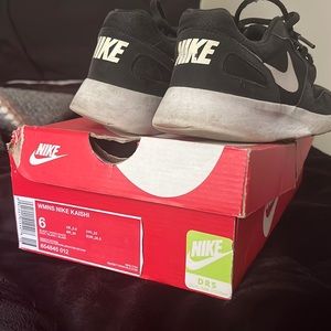 Beat up pair of Nike shoes